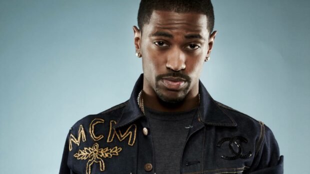 A close up portrait of Big Sean wearing a denim jacket against a blue background, HD Desktop Wallpaper