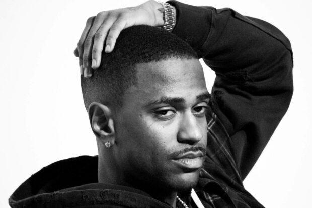 Big Sean Wallpapers shows a thoughtful man with a hand on his head, HD Desktop Wallpaper