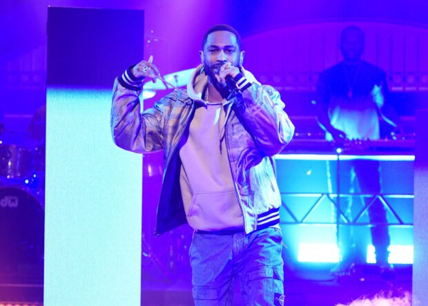 Big Sean is performing on stage with vibrant blue lighting, HD Desktop Wallpaper