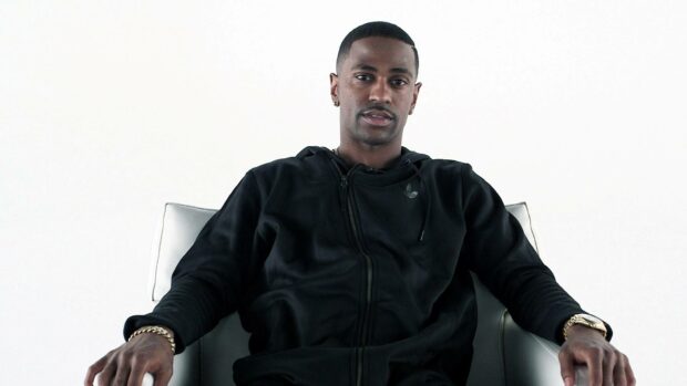 Big Sean wallpapers shows him sitting confidently in a black hoodie chair, HD Desktop Wallpaper