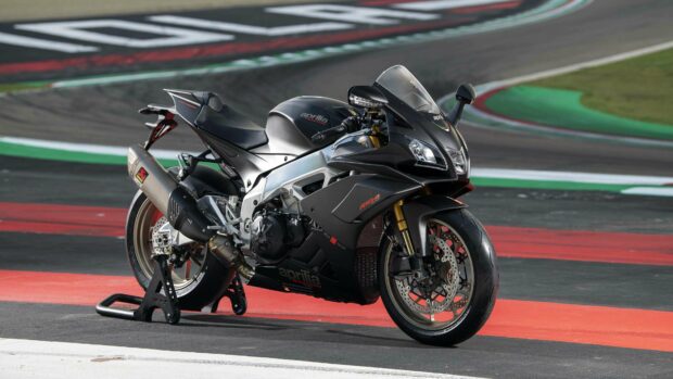 The Aprilia superbike is parked on the race track with a clear view of its detailed design, 4K Desktop Wallpaper