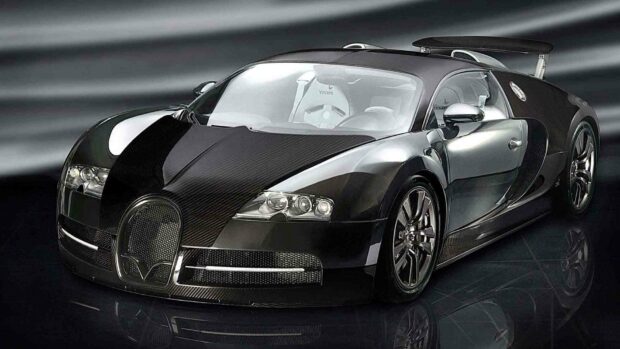 The black Bugatti Veyron features carbon fiber accents and sleek design, HD Desktop Wallpaper