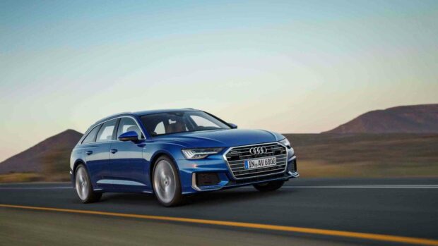 A blue Audi A6 is driving swiftly on an open road with mountains in the background, HD Desktop Wallpaper