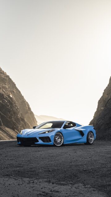Blue Chevrolet Corvette Parked Between Rocky Mountains High Quality Wallpaper