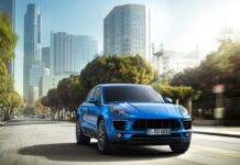 Blue Porsche Macan Driving Through Urban Cityscape Porsche Macan Wallpapers