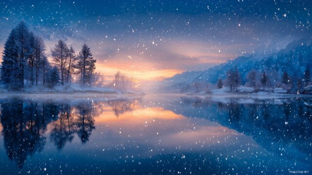 Blue Winter Wallpaper HD, A Tranquil Scene Of A Frozen Lake Reflecting The Blue Hues Of A Winter Sunset With Snowflakes Gently Falling