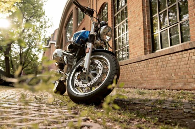 A blue Bmw R Nine T motorcycle parked near a brick building on a sunny day, HD Desktop Wallpaper