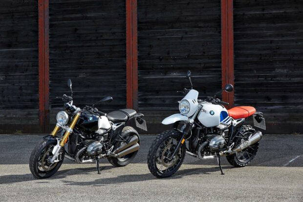 Two Bmw R Nine T motorcycles parked on pavement in front of wooden wall, HD Desktop Wallpaper