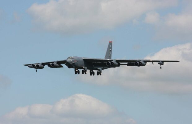 A Boeing B 52 is flying in the sky with clouds in the background, HD Desktop Wallpaper