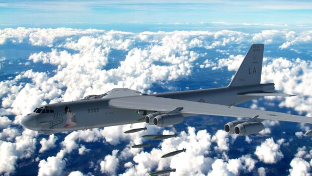 A Boeing B 52 is seen releasing multiple bombs over a cloudy sky during a mission, HD Desktop Wallpaper