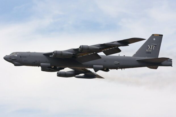 A Boeing B 52 aircraft flying under cloudy skies, 2K Desktop Wallpaper