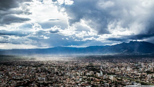 A panoramic view of a Bolivian city with mountains and cloudy sky in the background, HD Desktop Wallpaper