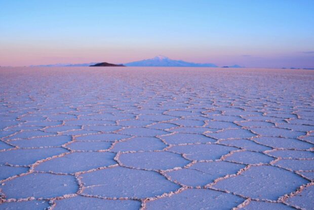 The vast Bolivia salt flats stretch across the horizon under a colorful sunset sky, HD Desktop Wallpaper