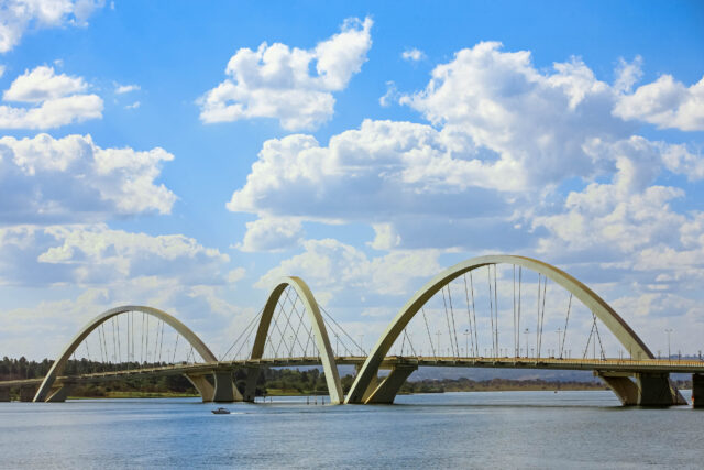 Brasilia's Iconic Bridge Against A Blue Sky Wallpaper