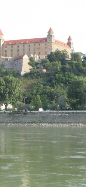 Bratislava Wallpapers feature the historic castle overlooking the river and lush greenery, HD Mobile Wallpaper
