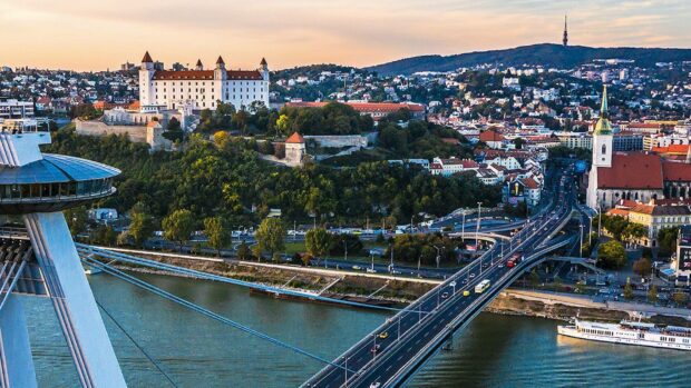 The Bratislava city skyline with the bridge and the historic castle is seen during sunset, HD Desktop Wallpaper