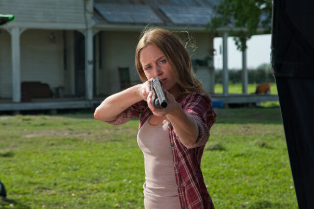 Brave Woman Aiming Shotgun At Rural House Tristar Pictures Scene