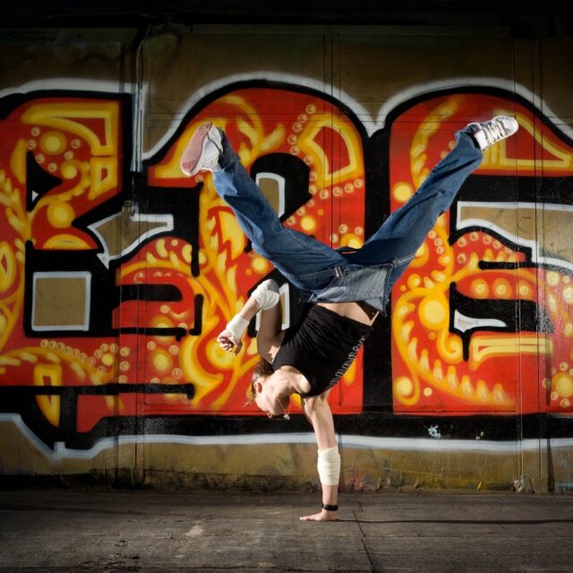 Breakdancing Freestyle In Urban Graffiti Background