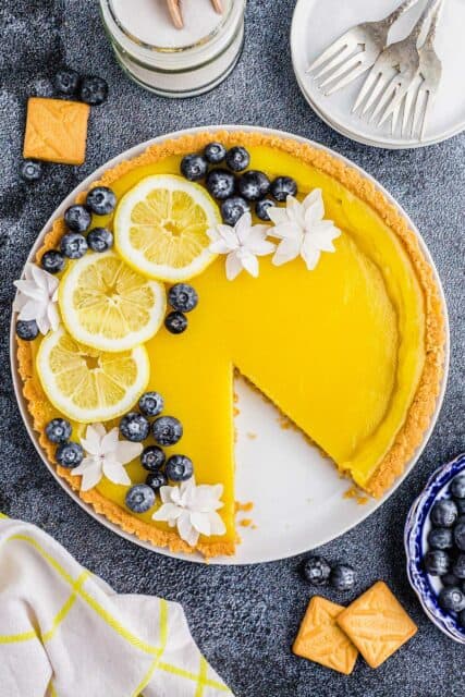 Bright Lemon Tart with Blueberries and Flowers on Dark Background Tart Wallpapers
