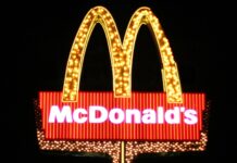 Bright McDonalds Logo Neon Sign on Dark Background for McDonalds Wallpapers