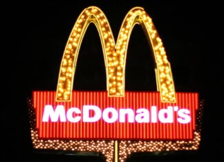 Bright McDonalds Logo Neon Sign on Dark Background for McDonalds Wallpapers