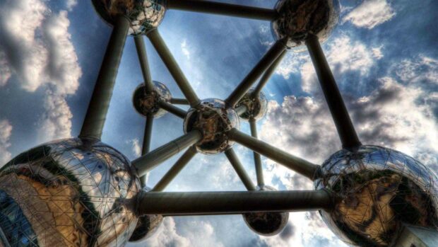 The Brussels atomium monument shines under the cloudy sky in this view, 2K Desktop Wallpaper