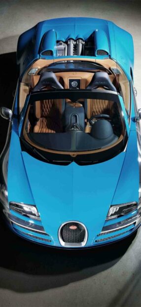 A sleek blue Bugatti Veyron with a luxurious brown interior is shown from above, HD Mobile Wallpaper