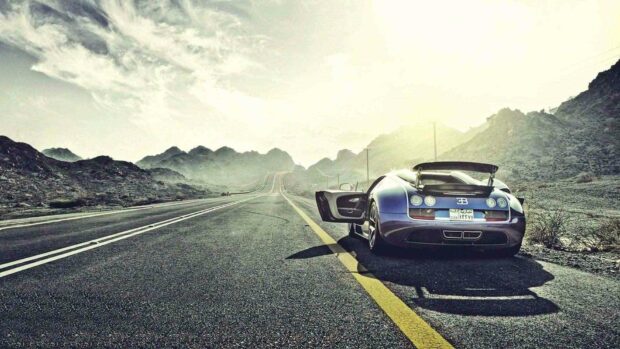 A Bugatti Veyron is parked on a winding mountain road with the door open under a bright sky, HD Desktop Wallpaper