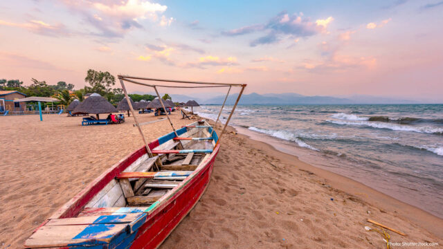Burundi Beach Sunset Scenic Wallpaper With Boat On Shore