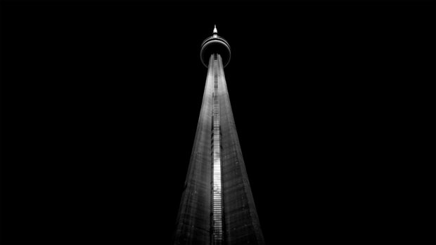 The CN Tower in Canada is lit up against a dark sky, 4K Desktop Wallpaper