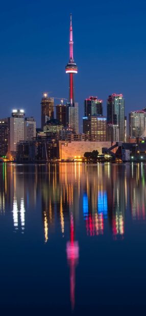 The CN Tower Canada Wallpapers stands tall reflecting in calm water during nighttime, HD Phone Wallpaper