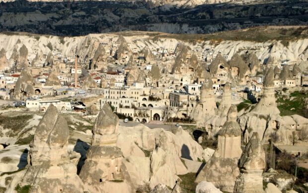The image shows unique rock formations and cave dwellings in Cappadocia, Cappadocia Wallpapers, HD Desktop Wallpaper