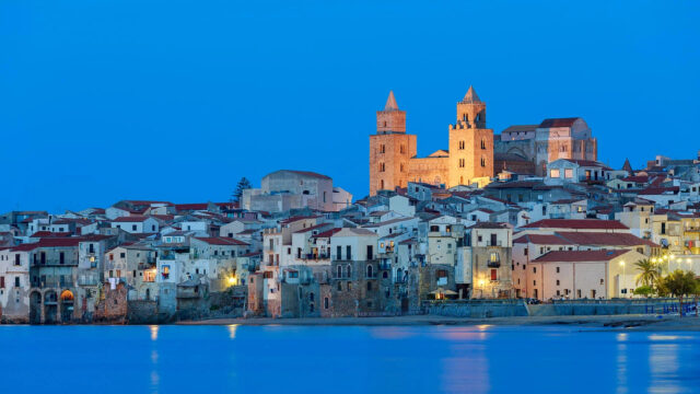 Cefalu Coastal Nightscape Wallpaper With Historic Buildings