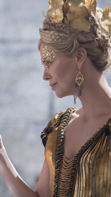 Charlize Theron As Ravenna Regal Portrait In Gold Dress Wallpaper