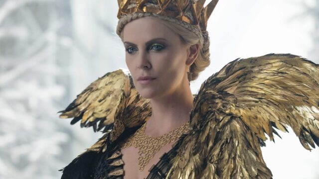 Charlize Theron As Ravenna In Gold Winged Costume Wallpaper