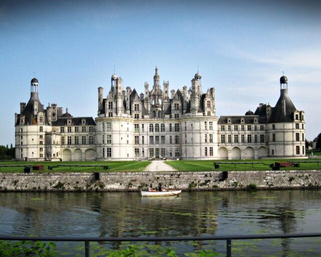 Chateau De Chambord Stunning Castle View With Boat On Water Wallpaper