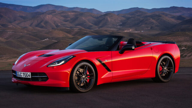 Chevrolet Corvette Convertible In Red With Mountain Background Wallpaper