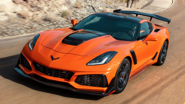 Chevrolet Corvette ZR1 Orange Sports Car Driving On Mountain Road Wallpaper