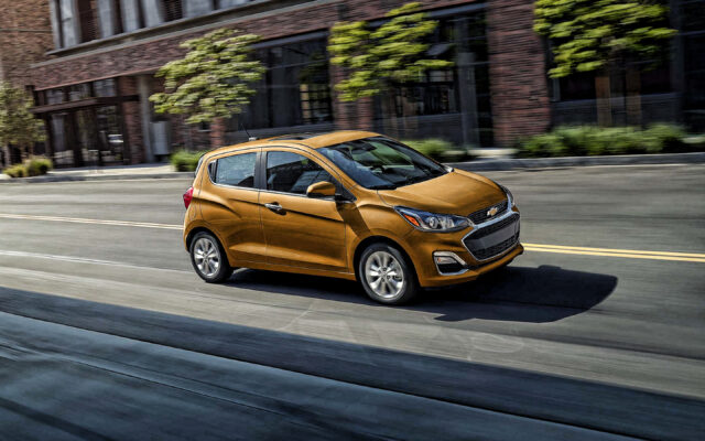 Chevrolet Spark In Motion On City Street Wallpaper