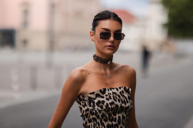 Chic Woman Wearing Brown Choker Necklace and Leopard Print Dress Urban Style Choker Wallpapers