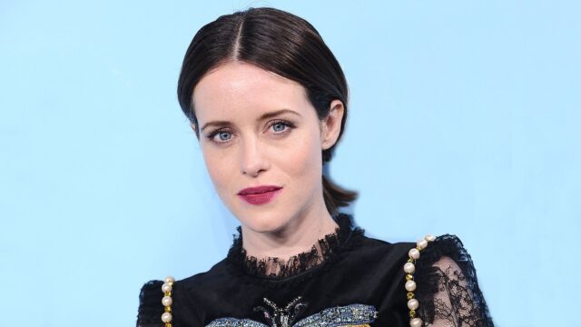 Claire Foy elegant portrait in black lace dress on blue background for wallpapers