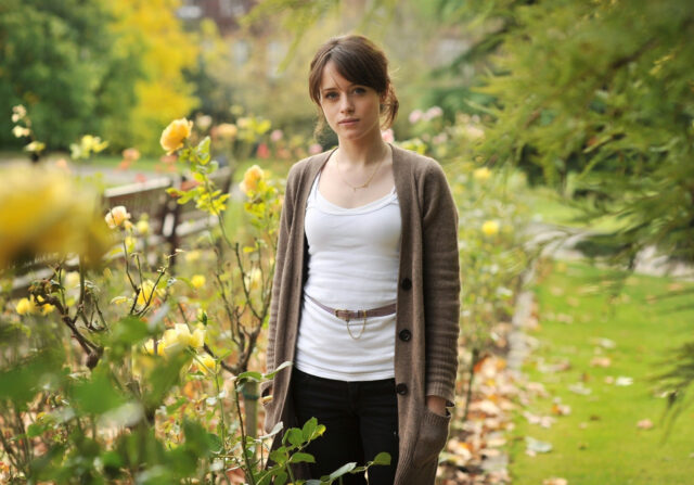 Claire Foy in Casual Outfit Standing in Garden with Yellow Roses for Wallpapers