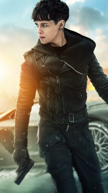 Claire Foy in edgy black leather jacket holding gun intense action wallpaper