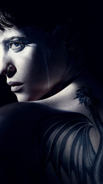 Claire Foy intense close up with dragon tattoo dark moody wallpaper