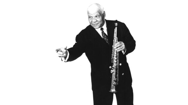 Clarinet Player Performing In Black And White Wallpaper