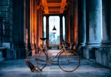 Classic Colnago Road Bike Wallpaper in Historic Urban Setting with Warm Lighting