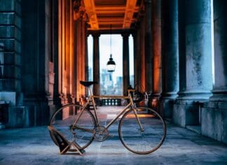 Classic Colnago Road Bike Wallpaper in Historic Urban Setting with Warm Lighting