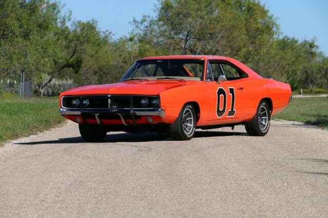 Classic General Lee Car in Bright Orange on Country Road for Wallpaper Background