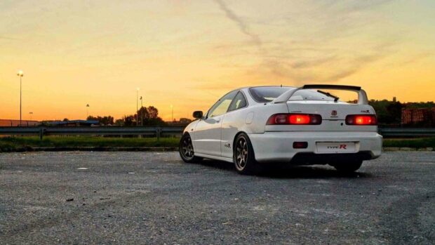 A white Honda Integra Type R is parked in an open area during sunset, HD Desktop Wallpaper