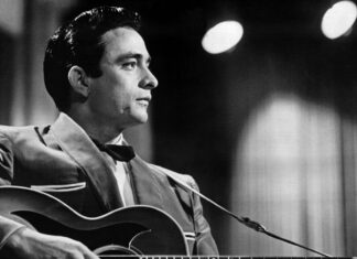 Classic Johnny Cash Guitar Performance Black And White Wallpaper